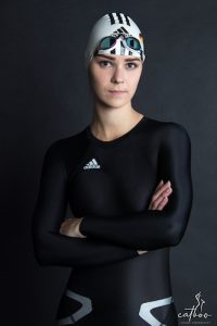 model in black adidas swimsuit